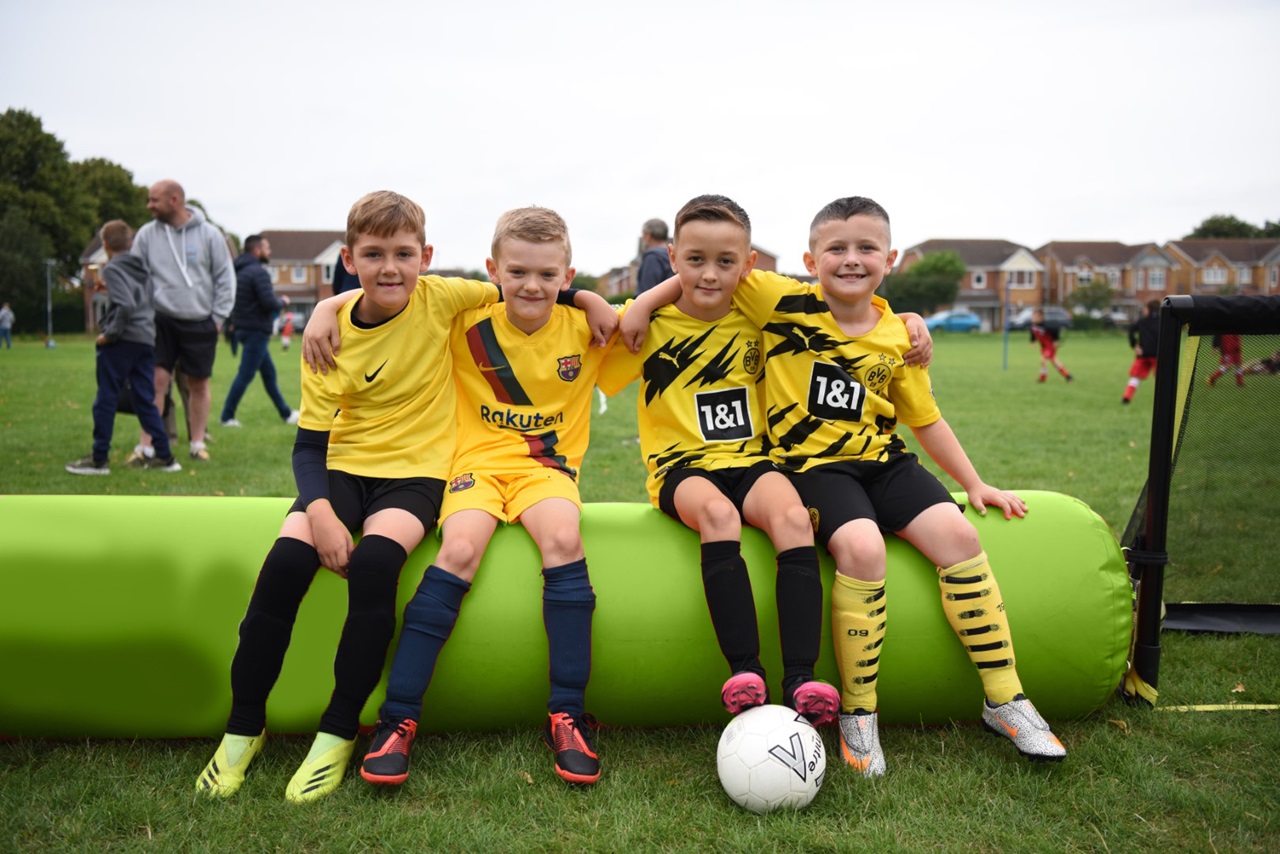 3 young players at a 3v3 football festival