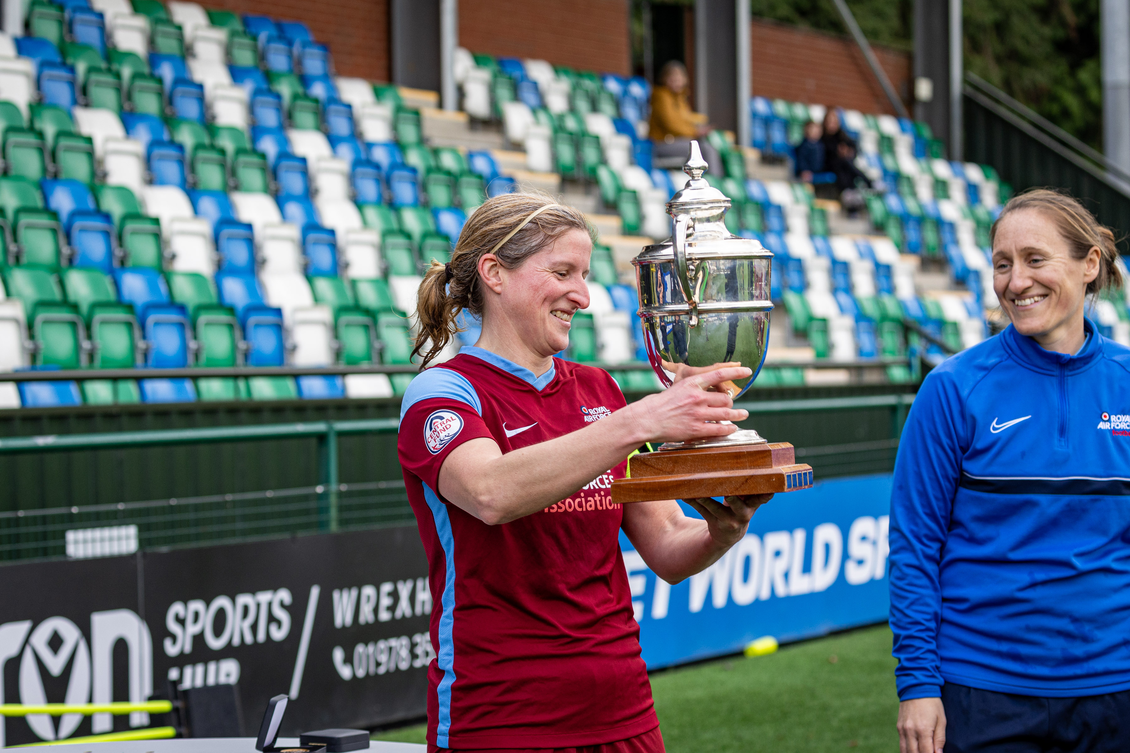 Cat Beaver lifts the Inter Services trophy 2024