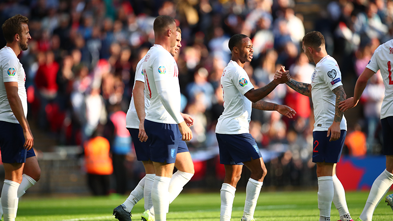 Keiren Tripper congratulates Raheem Sterling for his first goal of the match taking England to three goals in total