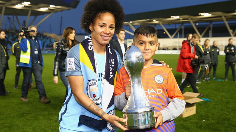 Demi Stokes poses with the FA WSL 1 trophy