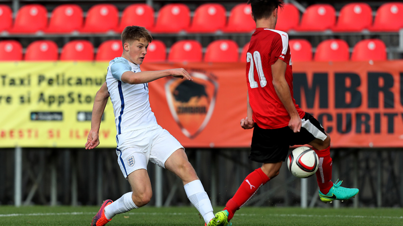 England Under-17s defender Lewis Gibson strikes home against Austria