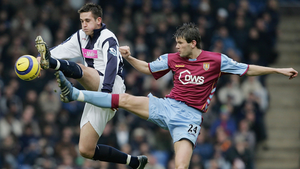 Darren Carter clashes with Eirik Bakke during a West Brom v Aston Villa clash