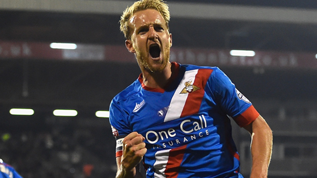 James Coppinger celebrates a goal against Fulham in 2014