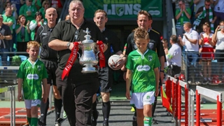 The officials are joined by The Emirates FA Cup trophy in Guernsey. Photo by Andy Dovey