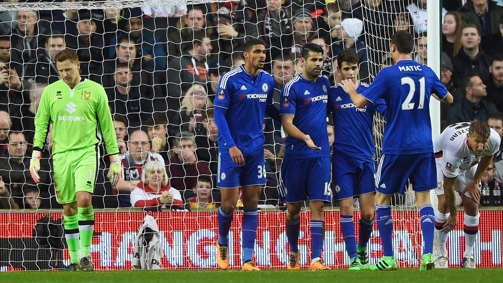 Oscar, second right, is congratulated by his Chelsea team-mates