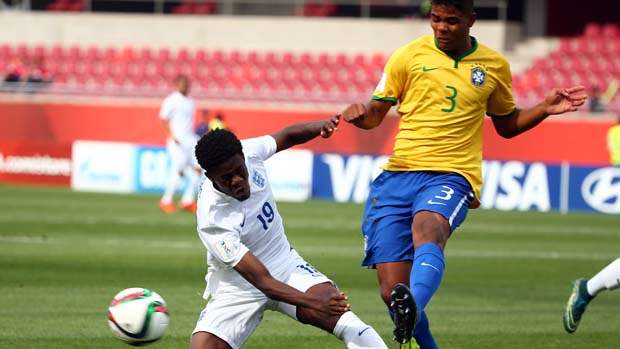 Ike Ugbo tackles Brazilian defender Ronaldo in the early stages of the game
