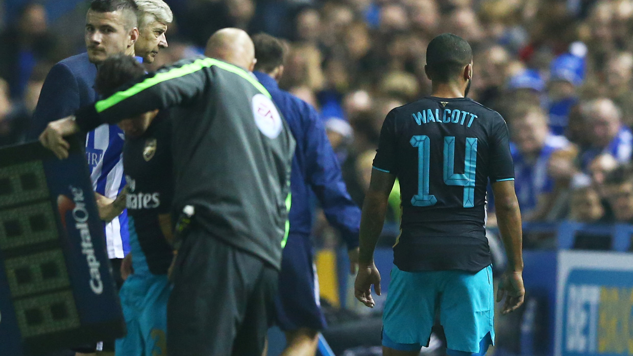 Theo Walcott limped off at Sheffield Wednesday