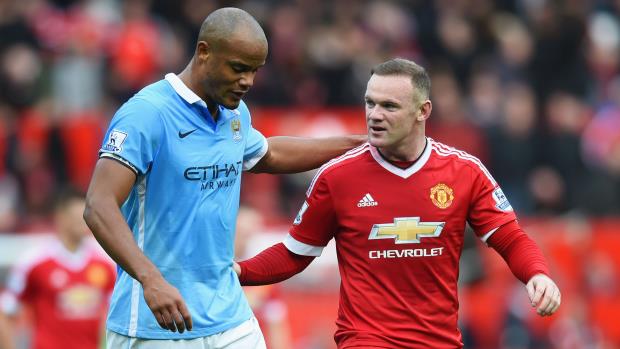 City captain Vincent Kompany (left) with Wayne Rooney at Old Trafford