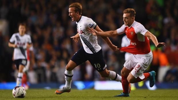Tottenham captain Harry Kane tussles with Arsenal