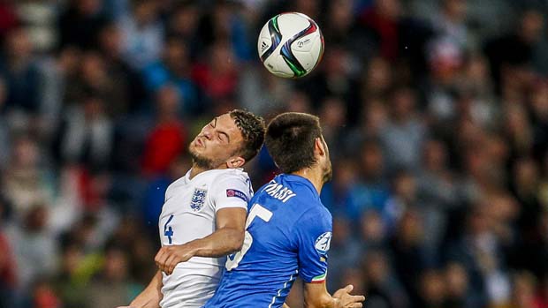 Jake Forster-Caskey contests an aerial challenge against Italy at Euro 2015.