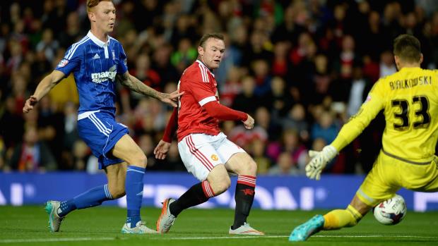 Wayne Rooney opens the scoring for Manchester United against Ipswich