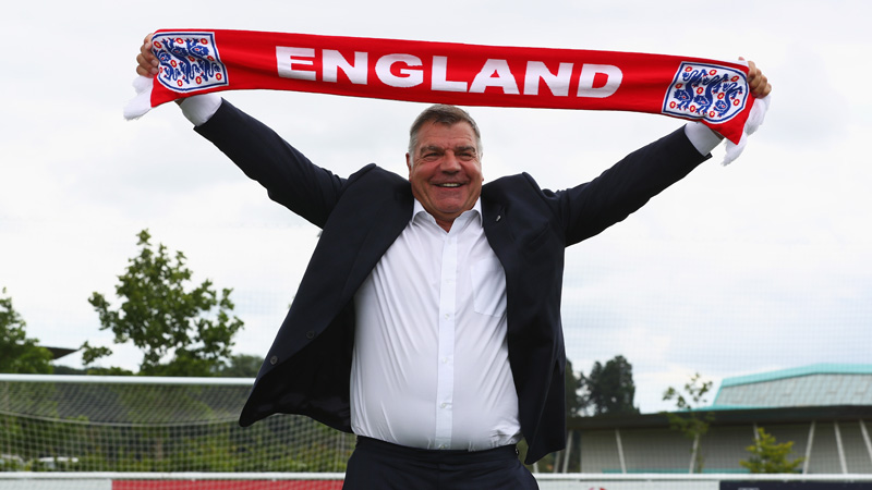 England manager Sam Allardyce holds aloft a Three Lions scarf at St. George