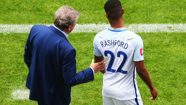 Marcus Rashford receives last-minute instructions from Roy Hodgson
