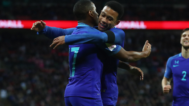 Luciano Narsingh (left) and Memphis Depay celebrate the former