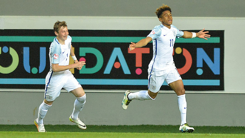 Reiss Nelson celebrates with fellow goalscorer Ben Morris after netting in England
