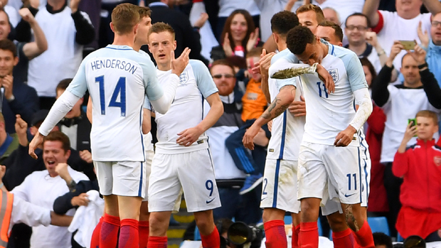 Jamie Vardy is congratulated by England team-mates after his winner against Turkey