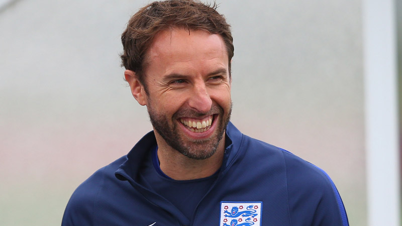 England Under-21s head coach Gareth Southgate smiles during training at St. George