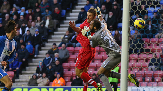 Rickie Lambert beats Wigan goalkeeper Ali Al Habsi to the ball to score