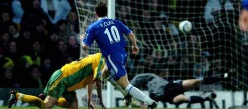 Chelsea midfielder Joe Cole sees his shot fly past Robert Green to give his side the lead at Carrow Road.