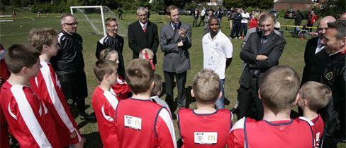Prince William speaks to players at Kingshurst Sporting FC in the West Midlands.