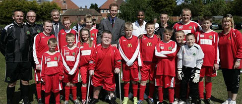 Kingshurst players and coaches line up alongside Prince William.