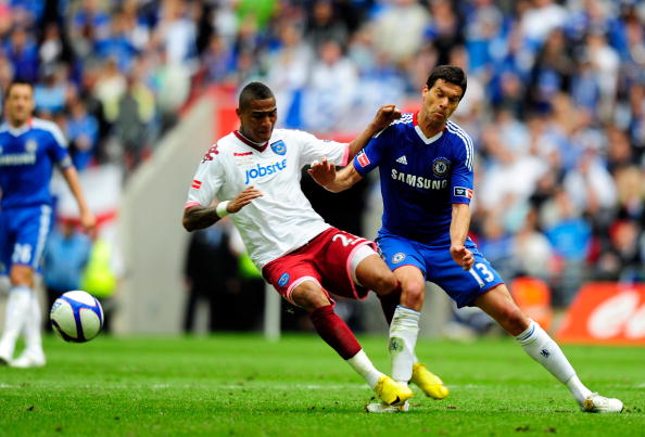 Kevin-Prince Boateng fouls Ballack