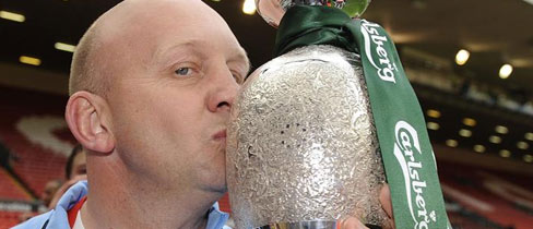 Scots Grey manager, Steve Osborne, kisses The FA Sunday Cup after his side's extra-time victory in The Final.