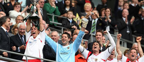 Stevenage captain Steve Morison lifts The FA Trophy.