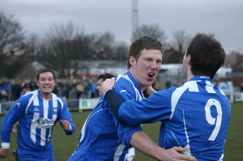 Whitley Bay captain Dave Coulson celebrates with Paul Robinson