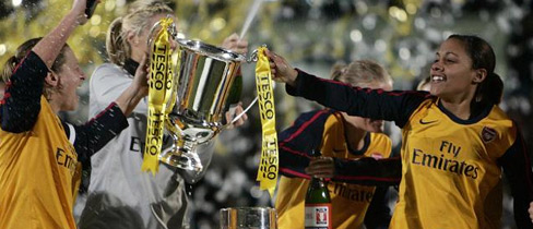 Jayne Ludlow (left) and Alex Scott (right) lift The FA Women's Premier League Cup