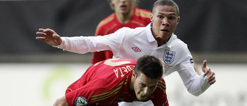 Kieran Gibbs and Cesar Azpilicueta tussle for the ball in Gothenburg.