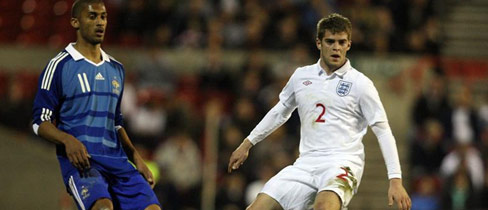 Armand Traore and Martin Cranie battle for possession.