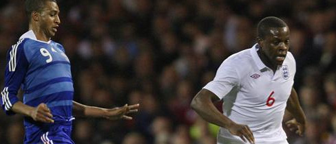 Nedum Onuoha takes the ball from Liverpool's David N'Gog