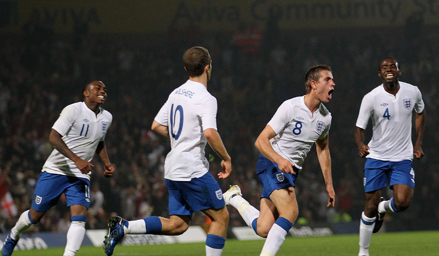 England Under-21 midfielder Jordan Henderson (third from left) celebrates his goal against Romania at Carrow Road.