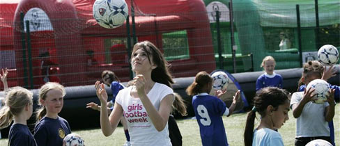 Faryl Smith encourages girls at Loughton Academy to play football.