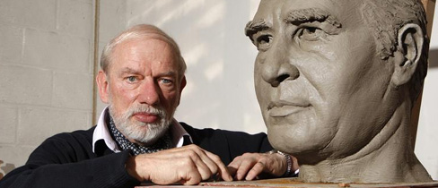 Philip Jackson stands next to his sculpture of Sir Alf Ramsey.