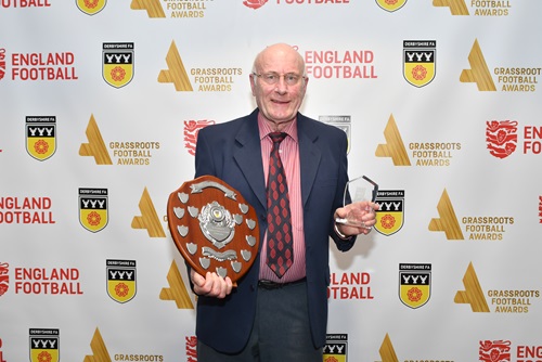 Mel Williams holding the John Clarke award
