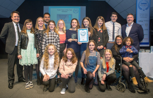 Stevenage Borough Junior Under-13 Girls receive their Youth Team of the Year award from Stevenage FC Foundation head Joe Goude. Picture: Cathy Benucci Photography