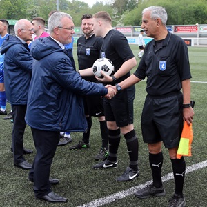 referee shakes hands with kent fa official