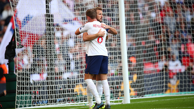 Harry Kane celebrates his second goal with Jordan Henderson