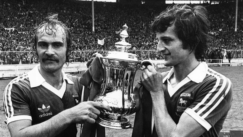1978: Ipswich Town captain, Mick Mills (left) holding the FA Cup with Roger Osbourne
