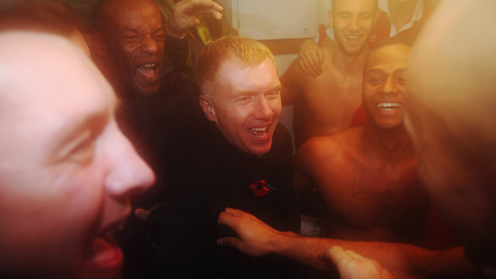Paul Scholes joins in the celebrations with Salford City players