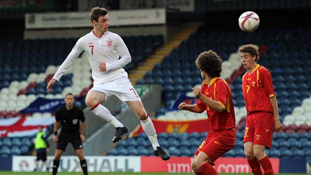 Will Keane heads at goal for England U19s against Montenegro in 2012.
