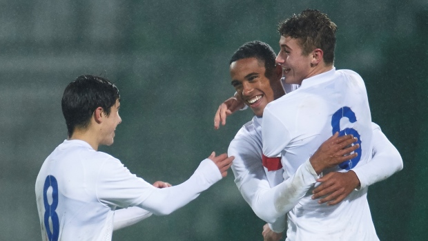 Ledson celebrates with Liam Walsh and Max Lowe