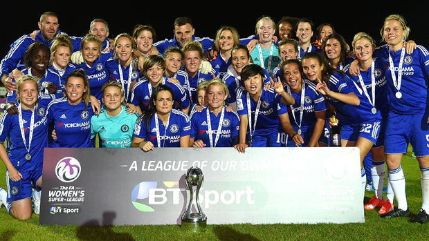 Chelsea players and staff pose with the FA WSL 1 title