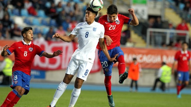 Marcus Wood wins a header against Chile