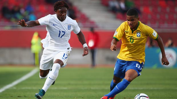Kaziah Sterling runs at Brazilian defender Rodgerio