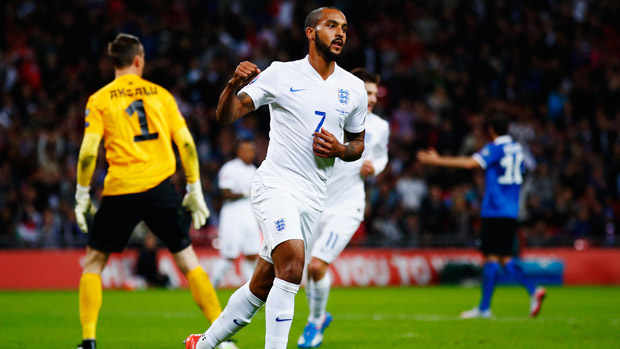 Theo Walcott celebrates after opening the scoring at Wembley