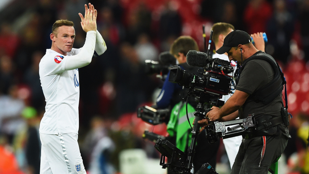 Wayne Rooney applauds England