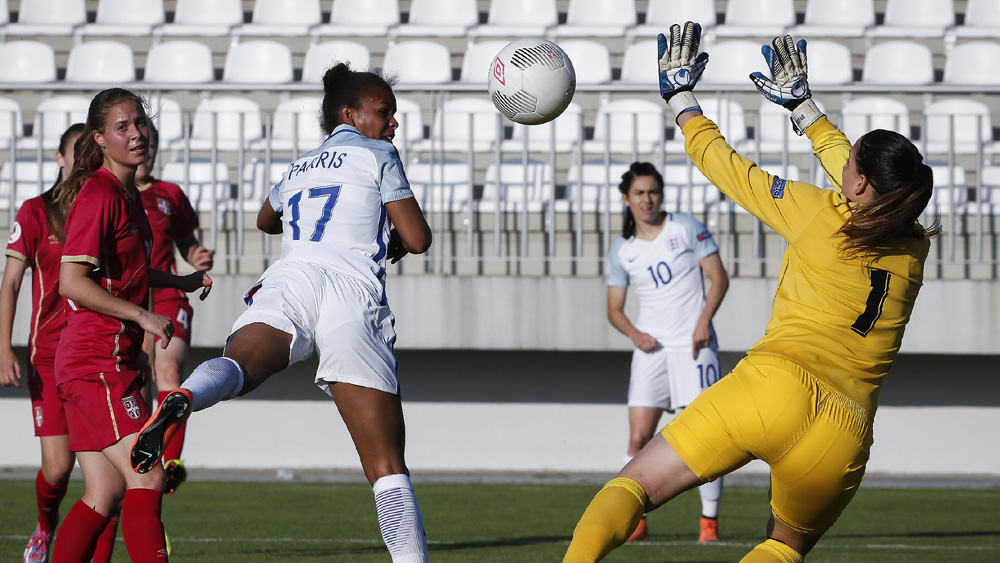 Nikita Parris nods home her first goal for England